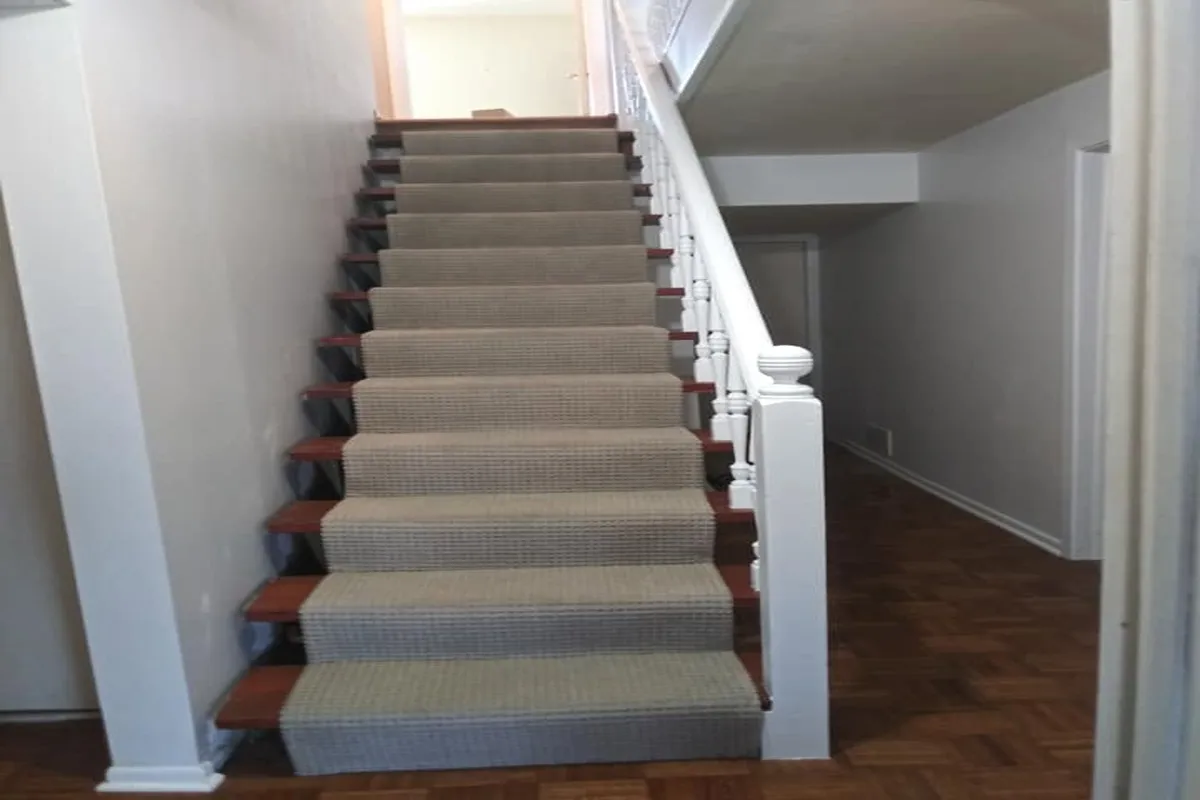 Staircase with a white railing